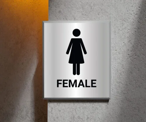 A "Female" restroom sign mounted above, clearly visible for easy identification in public spaces.